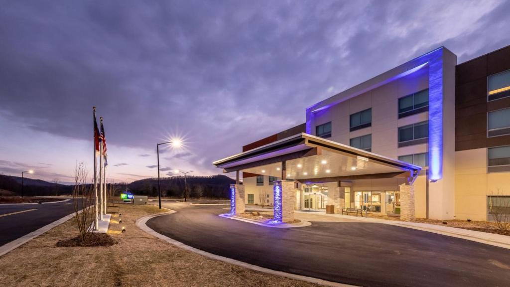 a building with blue lights on the side of it at Holiday Inn Express & Suites - Marion, an IHG Hotel in Marion