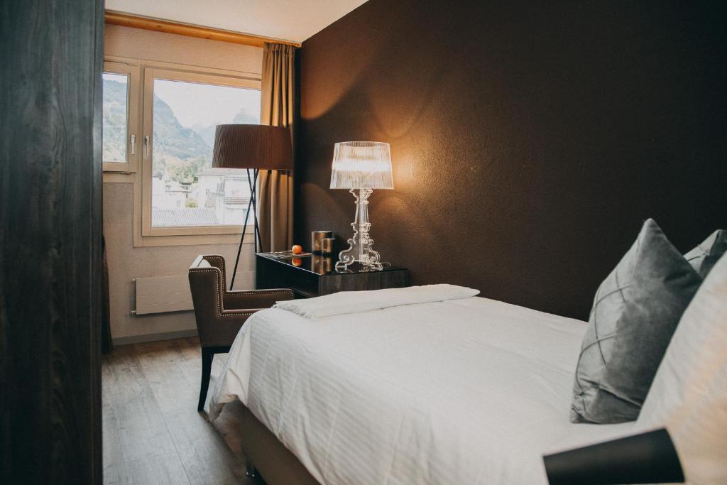 Postel nebo postele na pokoji v ubytování Hotel Dakota