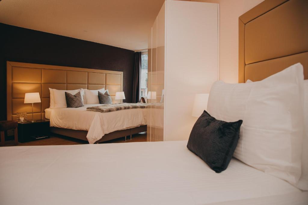 Postel nebo postele na pokoji v ubytování Hotel Dakota