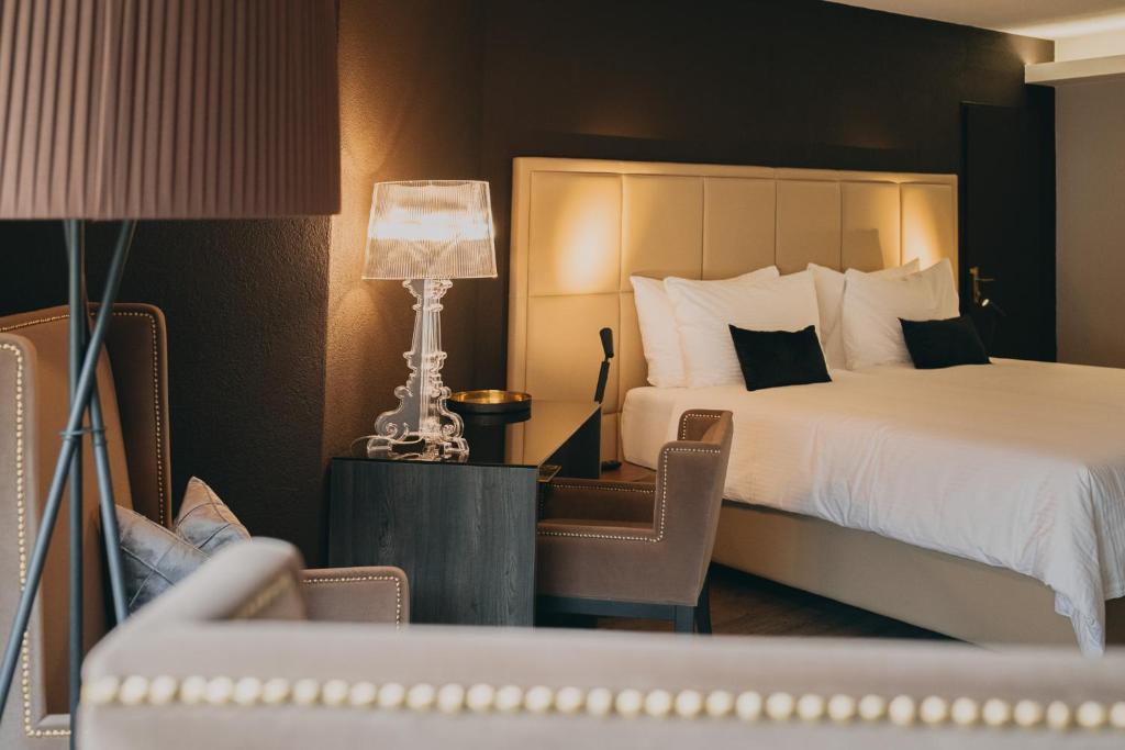 Postel nebo postele na pokoji v ubytování Hotel Dakota