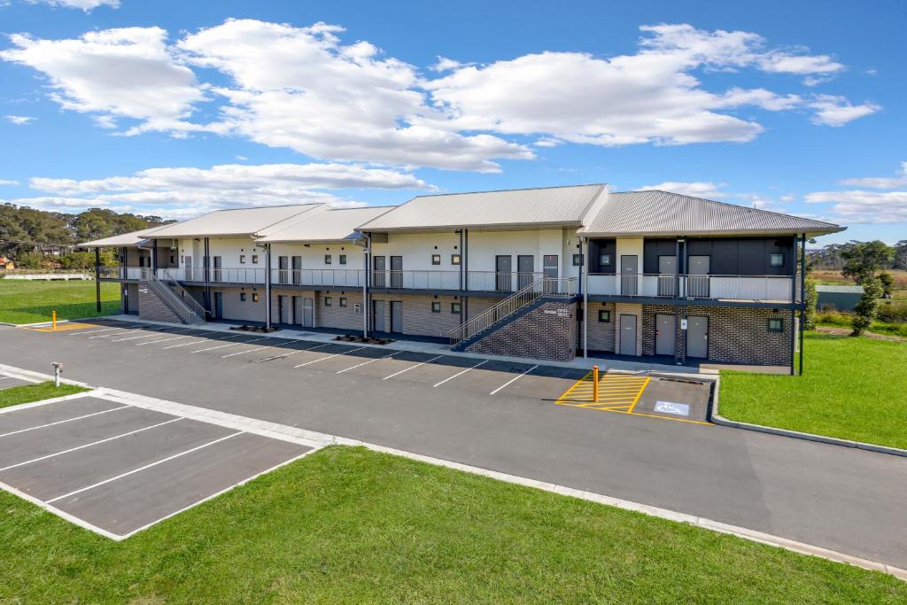 an aerial view of a building with a parking lot at Gateway Motel in Vineyard