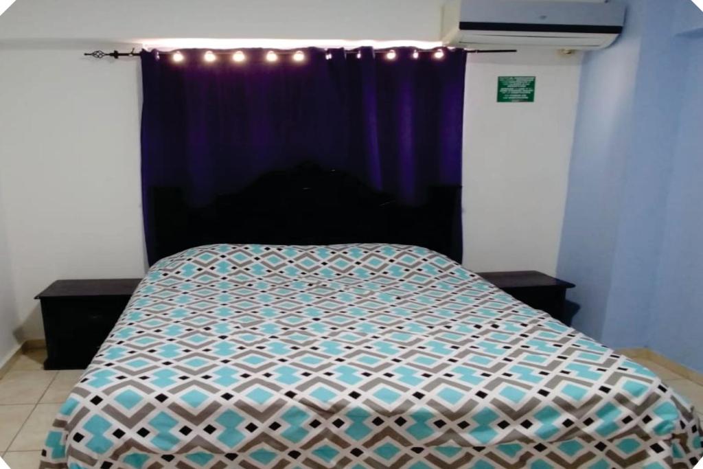 Postel nebo postele na pokoji v ubytování Hostal Magisterial Santo Domingo