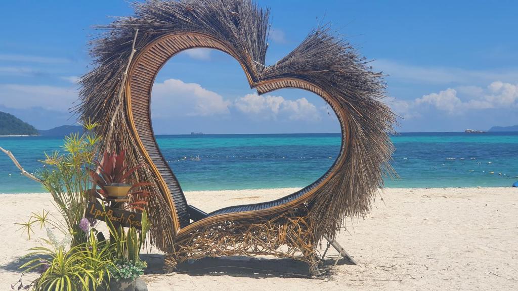 a heart made out of straw on a beach at Lipe Beach Resort in Ko Lipe