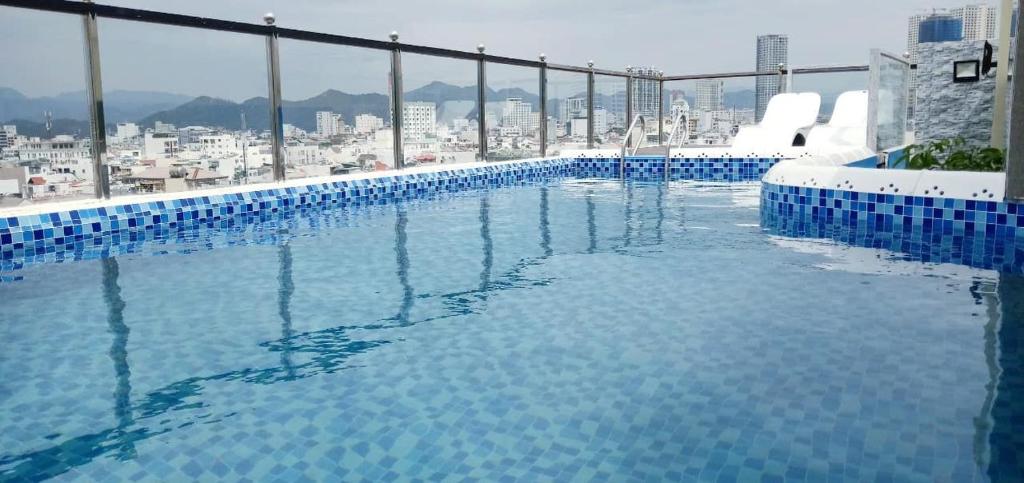 a large swimming pool on top of a building at Sen Vang Luxury Hotel in Nha Trang