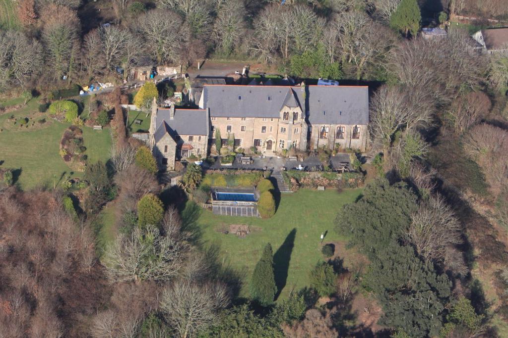 an aerial view of a large house with a yard at Peregrine hall in Lostwithiel