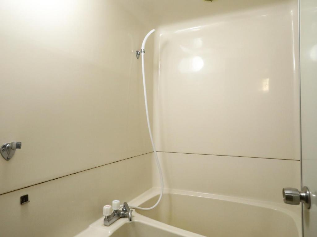 Koupelna v ubytování Hotel Umenoyu
