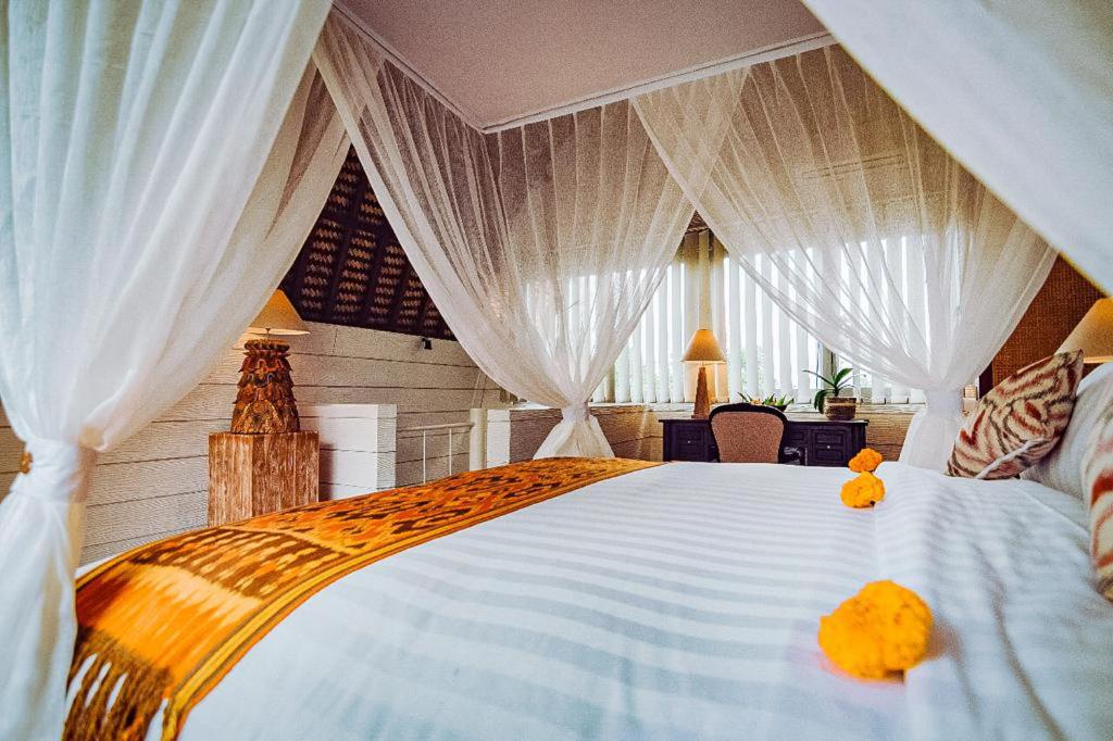 Postel nebo postele na pokoji v ubytování Tanamas Villas Ubud by Best Deals Asia Hospitality