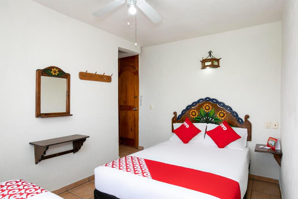 Ein Bett oder Betten in einem Zimmer der Unterkunft OYO La Casita