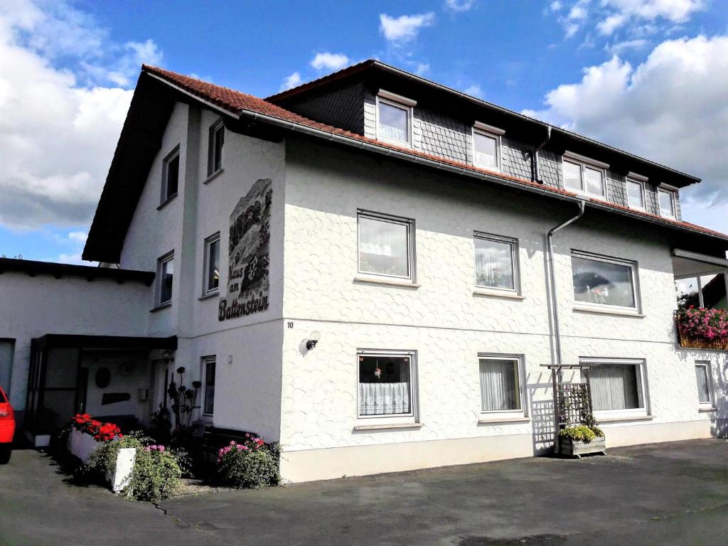 a white building with a lot of windows at Haus Am Battenstein in Hilders