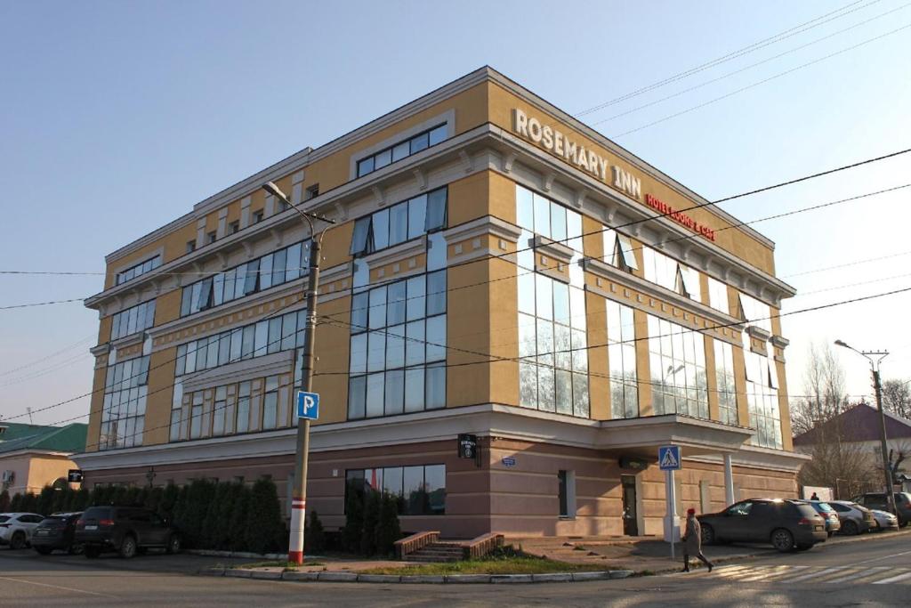 a large building on the corner of a street at Rosemary Inn in Saransk