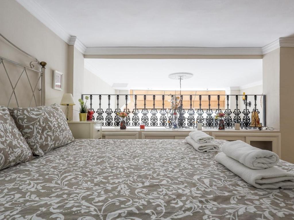 Posteľ alebo postele v izbe v ubytovaní Sueños de Sevilla duplex a calidades