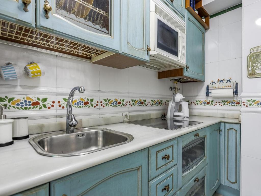 Kuchyňa alebo kuchynka v ubytovaní Sueños de Sevilla duplex a calidades
