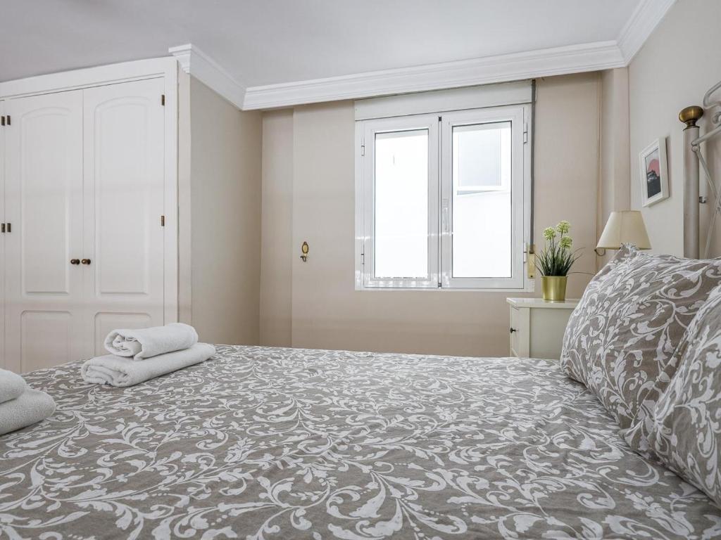 Posteľ alebo postele v izbe v ubytovaní Sueños de Sevilla duplex a calidades