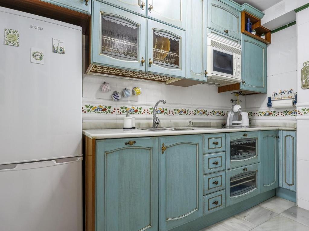 Kuchyňa alebo kuchynka v ubytovaní Sueños de Sevilla duplex a calidades