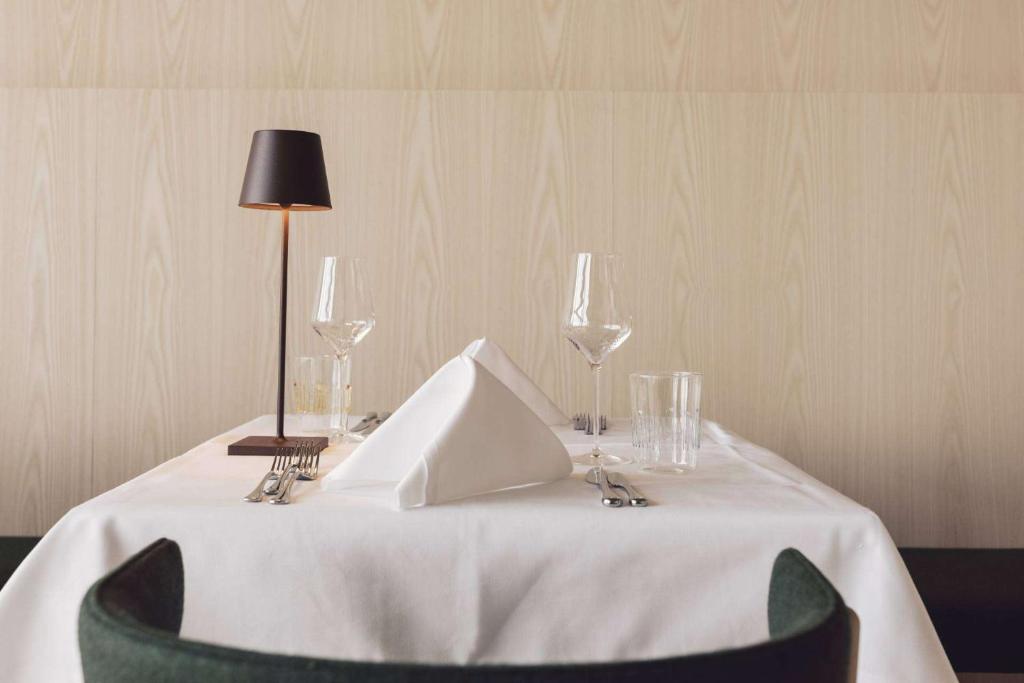 Postel nebo postele na pokoji v ubytování Hotel Milla Montis