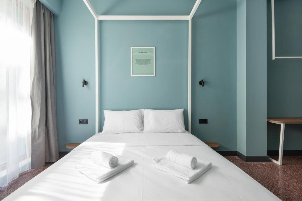 Letto o letti in una camera di Zeus is Loose Hostel