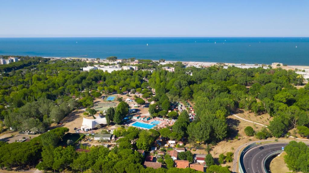 a scenic view of a beach with palm trees at Cesenatico Camping Village in Cesenatico