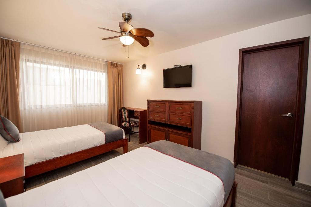 Postel nebo postele na pokoji v ubytování Hotel Senorial
