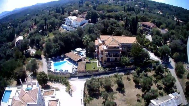 an aerial view of a large house with a swimming pool at Villa Yannis in Kato Korakiana