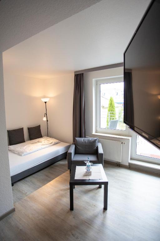 Postel nebo postele na pokoji v ubytování Das Loft Hotel Willingen