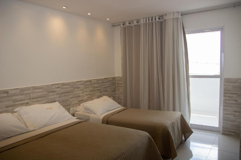 Krevet ili kreveti u jedinici u okviru objekta Hotel Costa do Atlântico