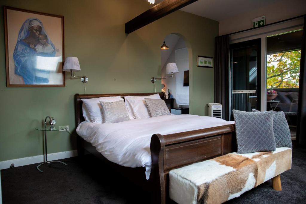 מיטה או מיטות בחדר ב-Amadeus Restaurant & Boutique Hotel