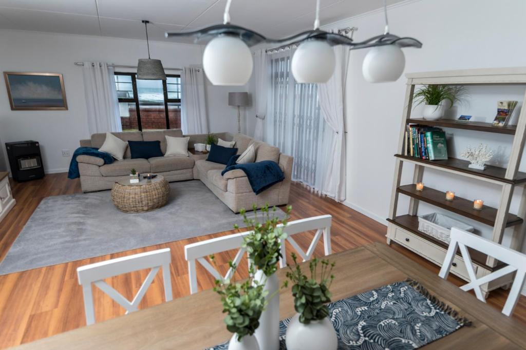 a living room with a couch and a table at Nordstrand Self-Catering Flat in Swakopmund