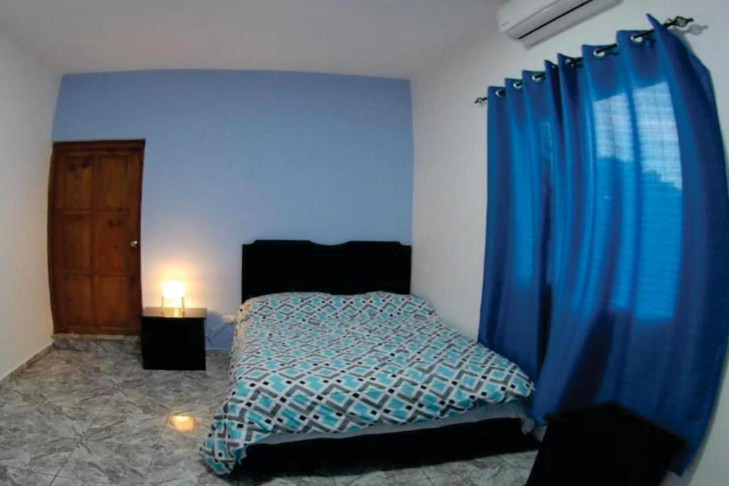 Postel nebo postele na pokoji v ubytování Hostal Magisterial Santo Domingo