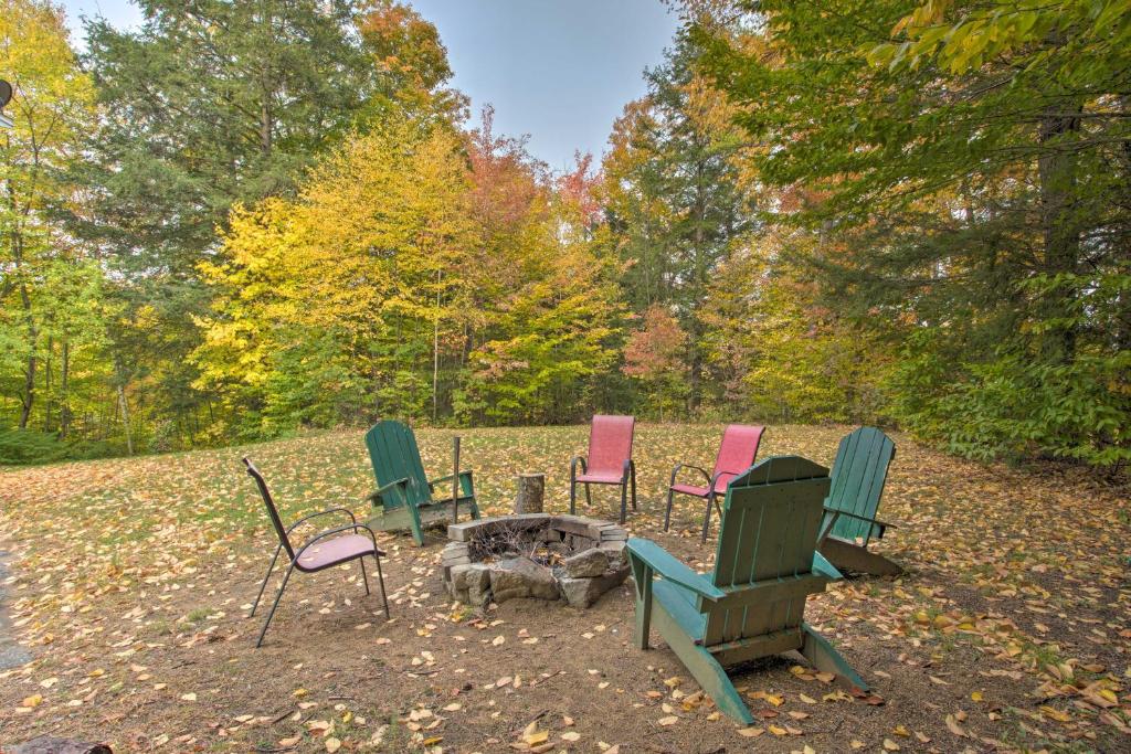 a group of chairs sitting around a fire pit at Pet-Friendly Gilford Home 3 Mi to Gunstock and Lake in Gilford