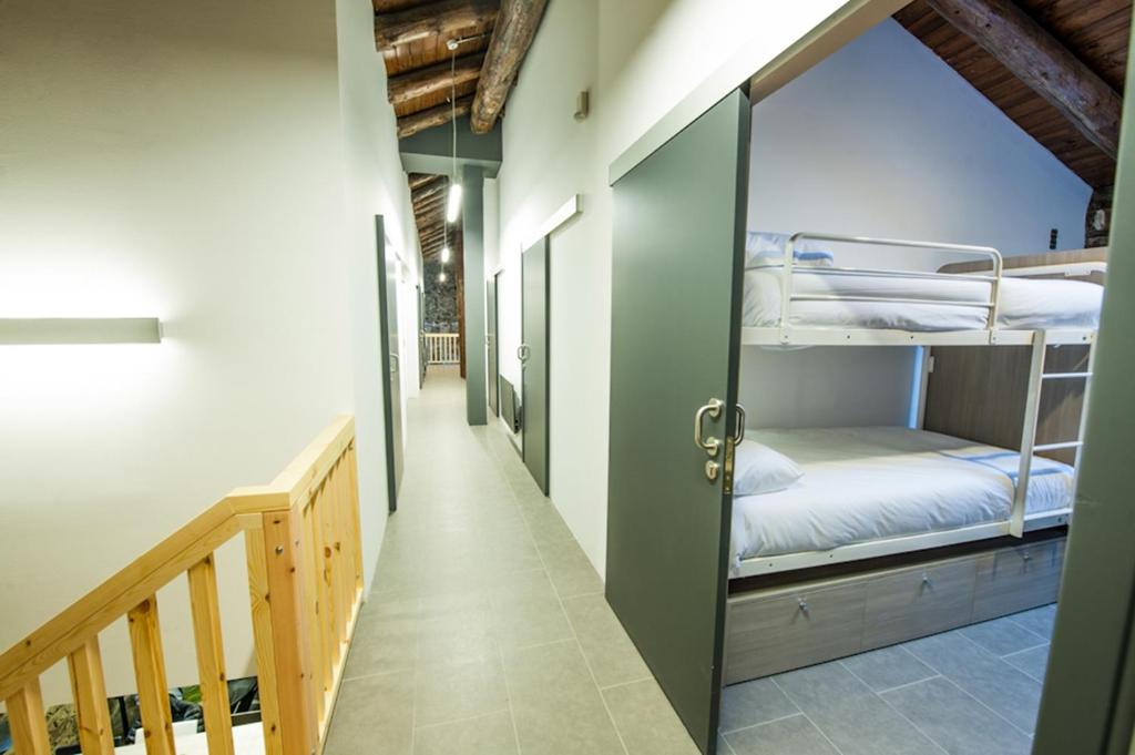 Postel nebo postele na pokoji v ubytování Mountain Hostel Tarter