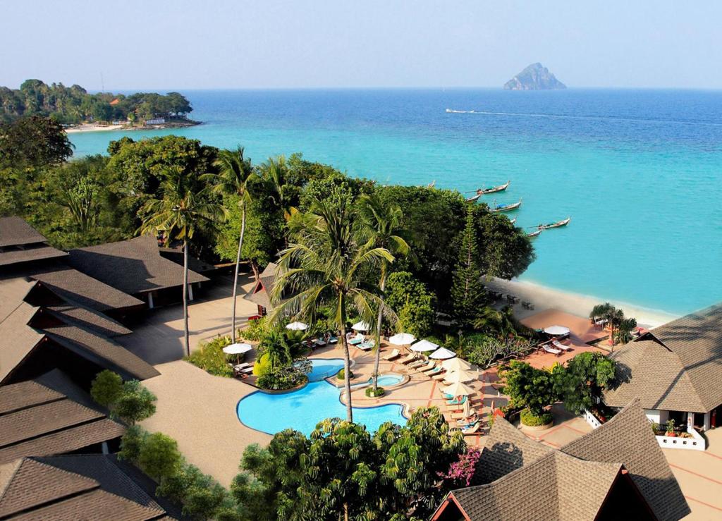 an aerial view of a resort with a pool and the ocean at Phi Phi Holiday Resort in Phi Phi Islands