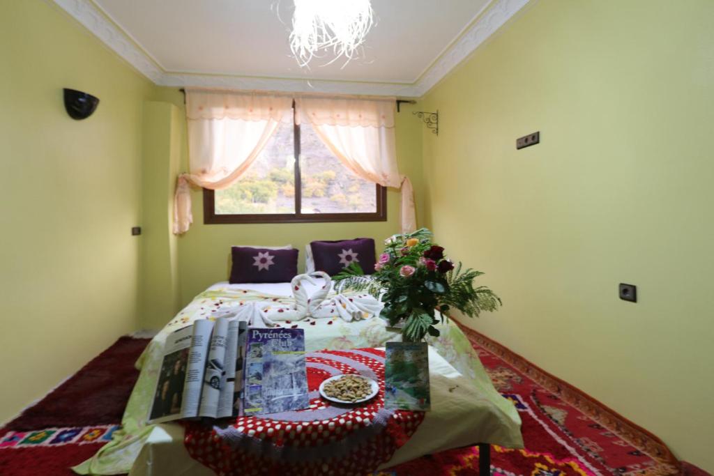 Postel nebo postele na pokoji v ubytování Dar Adouss