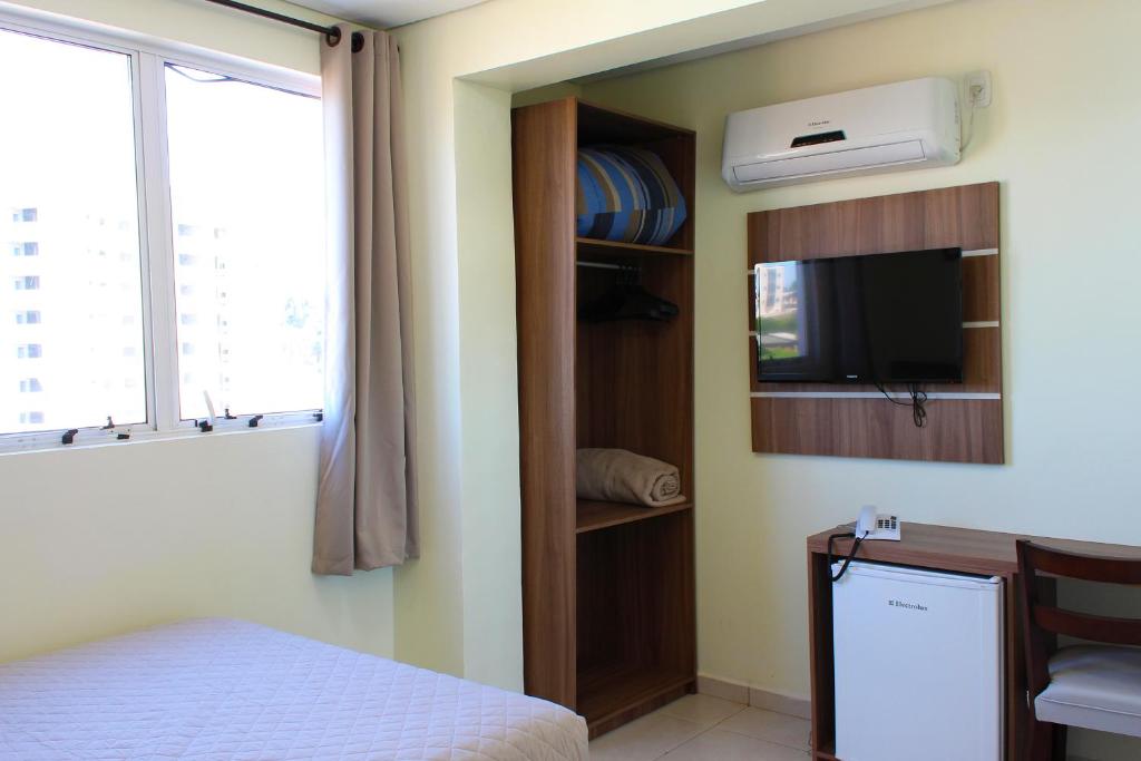 Postel nebo postele na pokoji v ubytování Tri Hotel Smart Chapecó