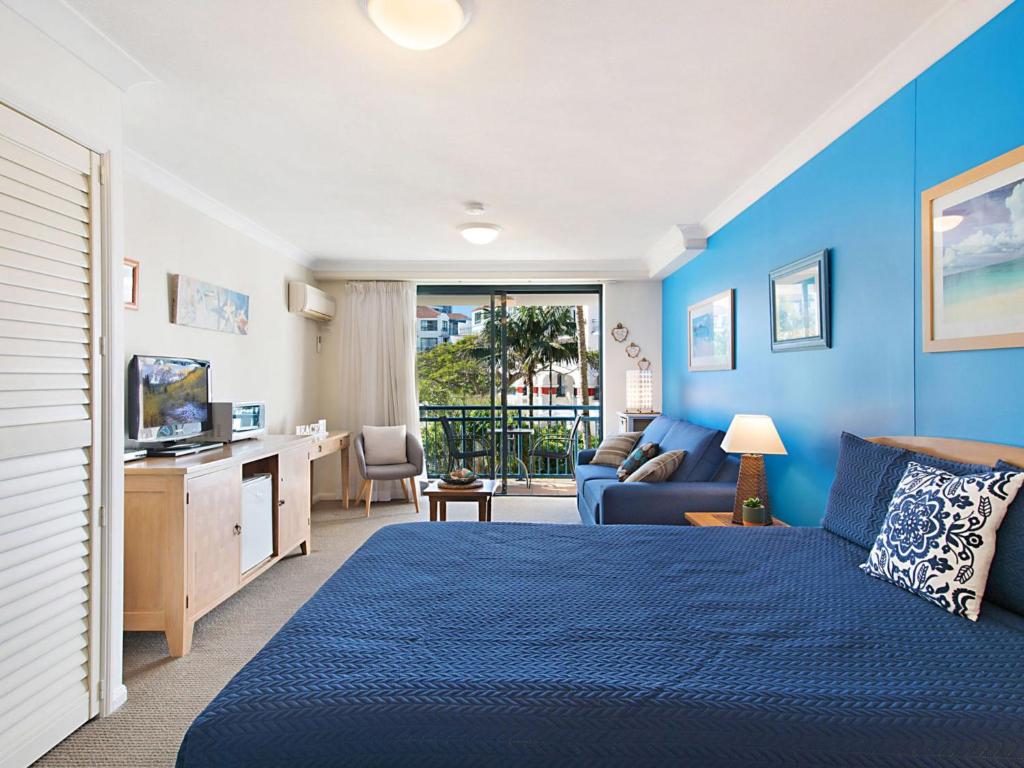 Postel nebo postele na pokoji v ubytování Calypso Plaza Resort Unit 215