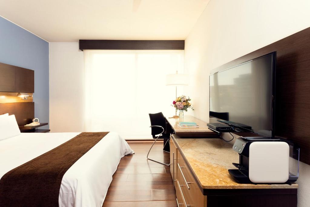 TV a/nebo společenská místnost v ubytování Mercure Bogota BH Retiro