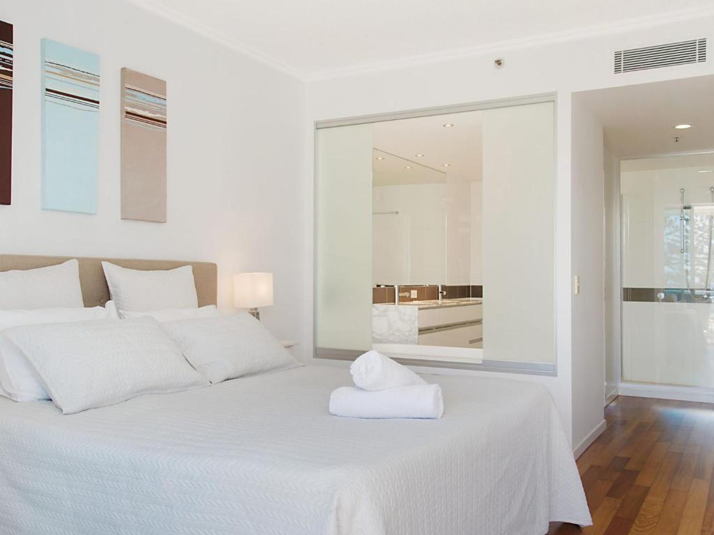 Letto o letti in una camera di Reflections tower 2 Unit 401