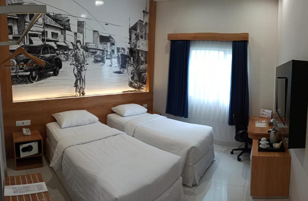 Una cama o camas en una habitación de Choice City Hotel