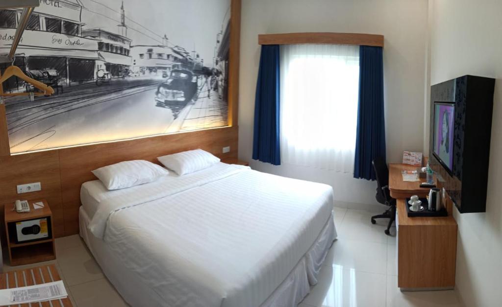 Una cama o camas en una habitación de Choice City Hotel