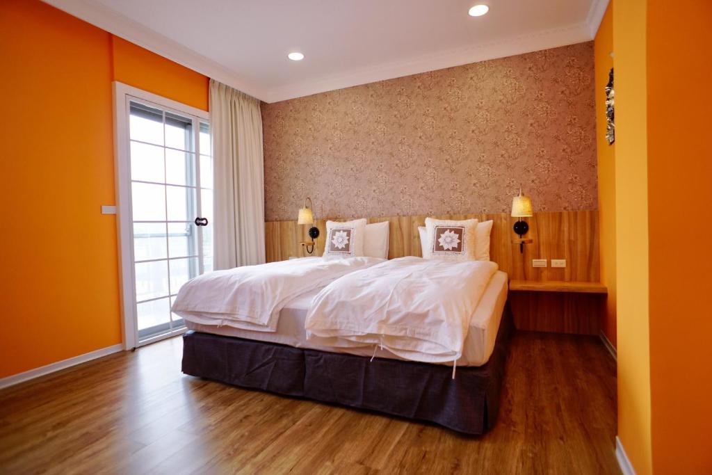 Postel nebo postele na pokoji v ubytování Dafu Qiandai Manor