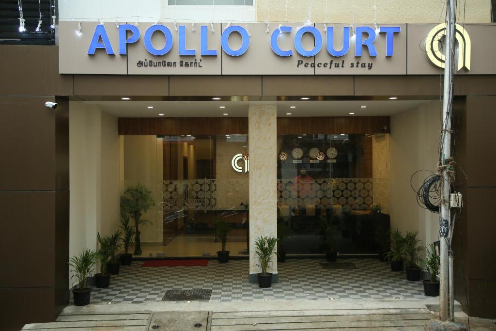 a building with a sign on the front of it at Apollo Court (Apollo hospital,Sankara natralya, US consulate in Chennai