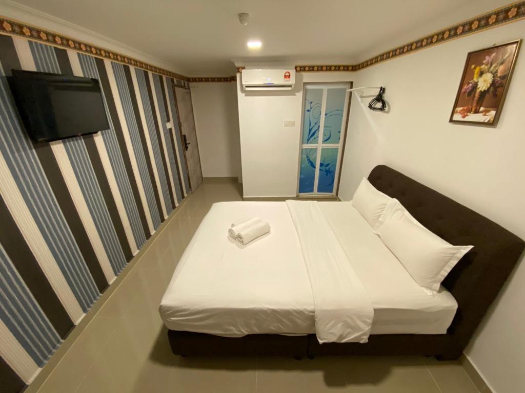 Postel nebo postele na pokoji v ubytování Shobi Hotel Johor Bahru Near CIQ JB