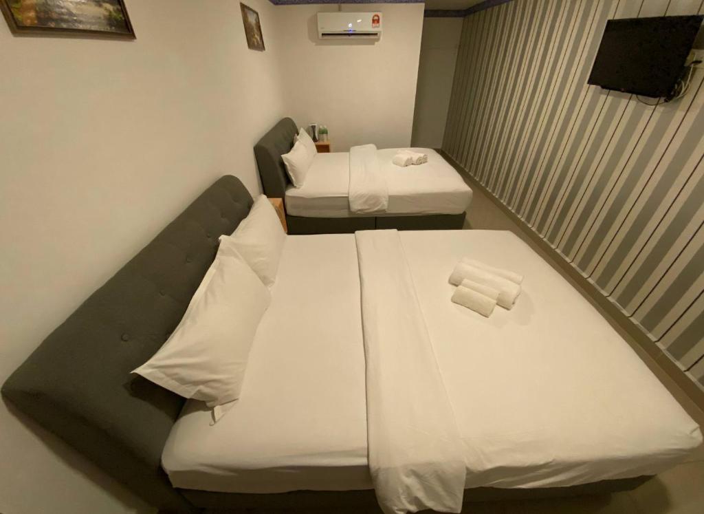 Postel nebo postele na pokoji v ubytování Shobi Hotel Johor Bahru Near CIQ JB