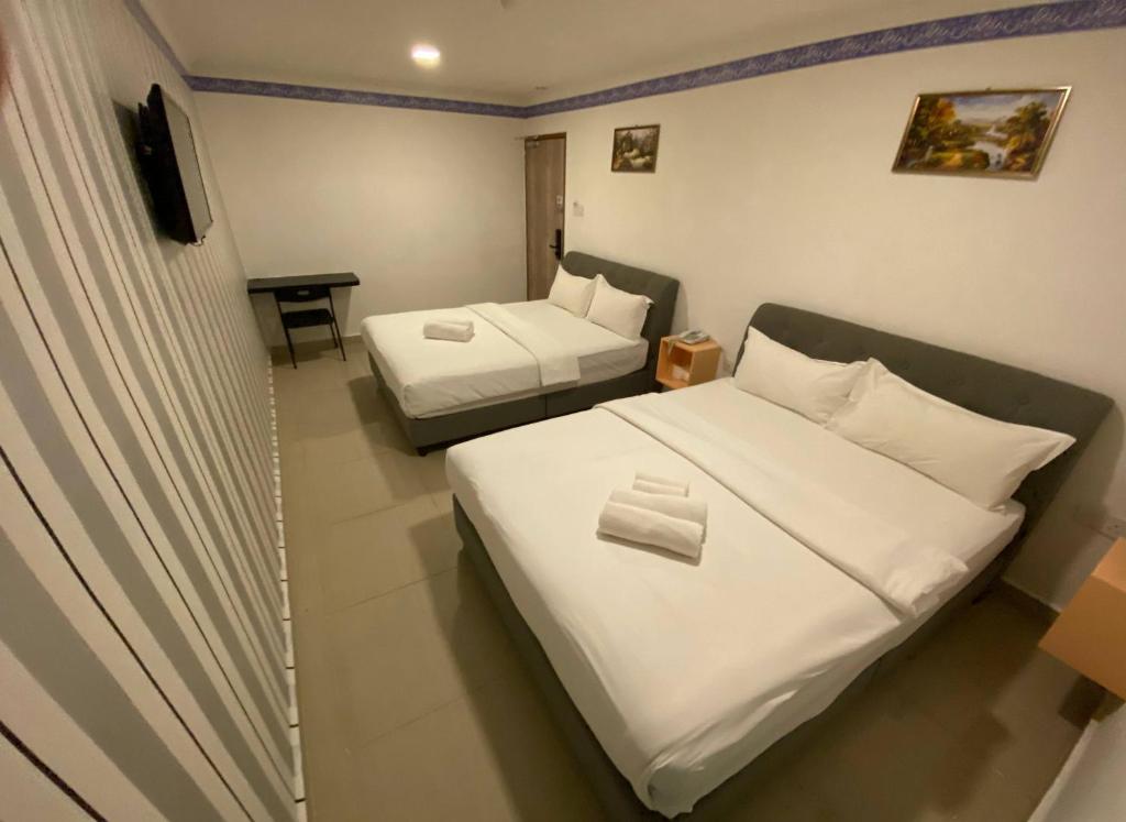 Postel nebo postele na pokoji v ubytování Shobi Hotel Johor Bahru Near CIQ JB
