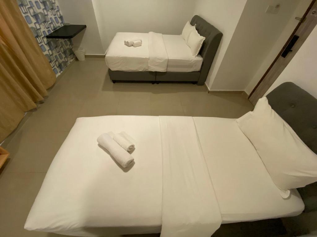 Postel nebo postele na pokoji v ubytování Shobi Hotel Johor Bahru Near CIQ JB
