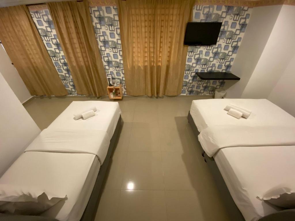 Postel nebo postele na pokoji v ubytování Shobi Hotel Johor Bahru Near CIQ JB
