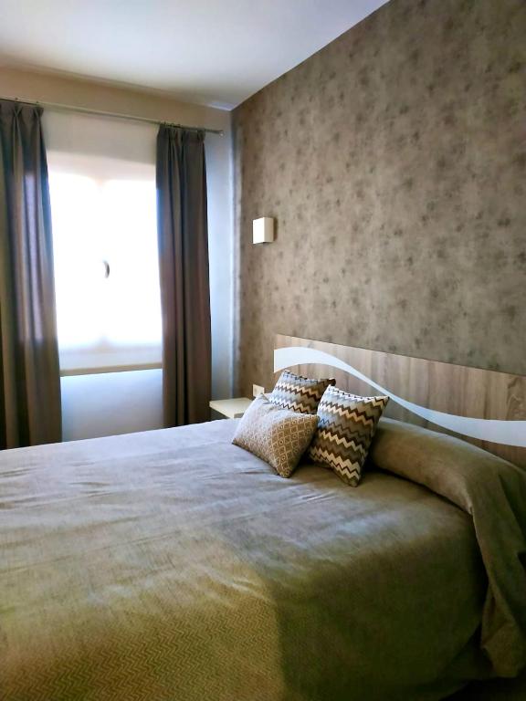 Postel nebo postele na pokoji v ubytování Hotel Los Conejos