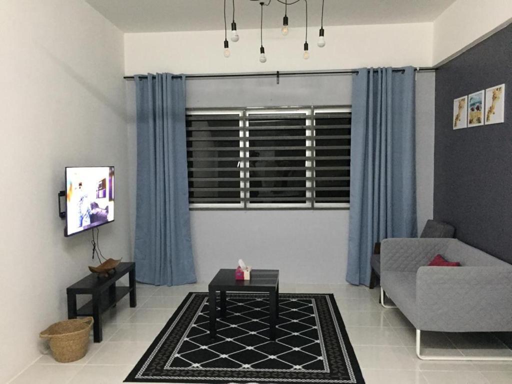 a living room with a couch and a table at Cinnamon Sutravilla Unit No D3A6 Lift Level 4, Sutravilla 2 in Kuantan