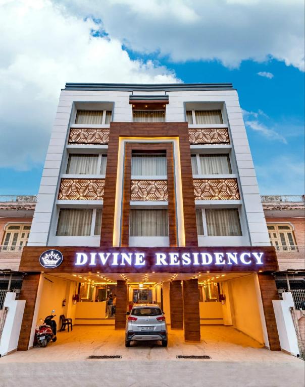a car parked in front of a building at Hotel Divine Residency by VARSHRI in Haridwār