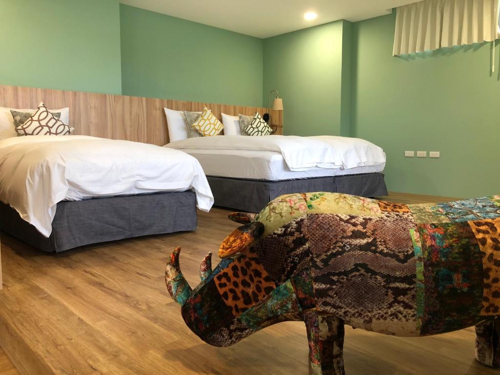 Postel nebo postele na pokoji v ubytování Dafu Qiandai Manor