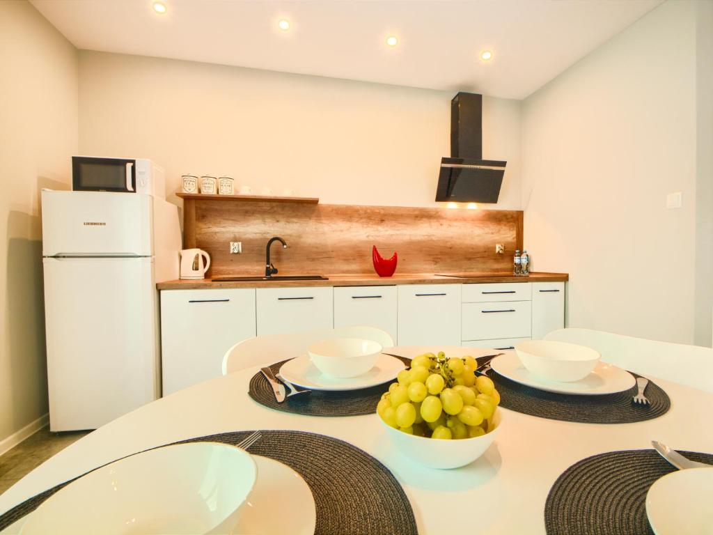 Kuchyň nebo kuchyňský kout v ubytování Apartamenty Szarotka